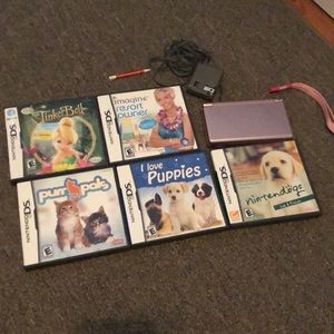 Pink Nintendo DS with charger and 5 games